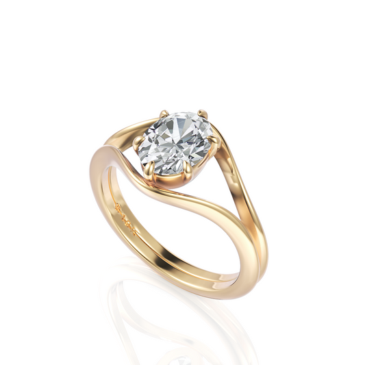 An 18k gold 'Brooklyn' engagement ring from Davidson Jewels featuring an oval brilliant cut diamond held by six claws, showcased against a simple background to highlight its elegance. Options available in yellow, white, or rose gold.